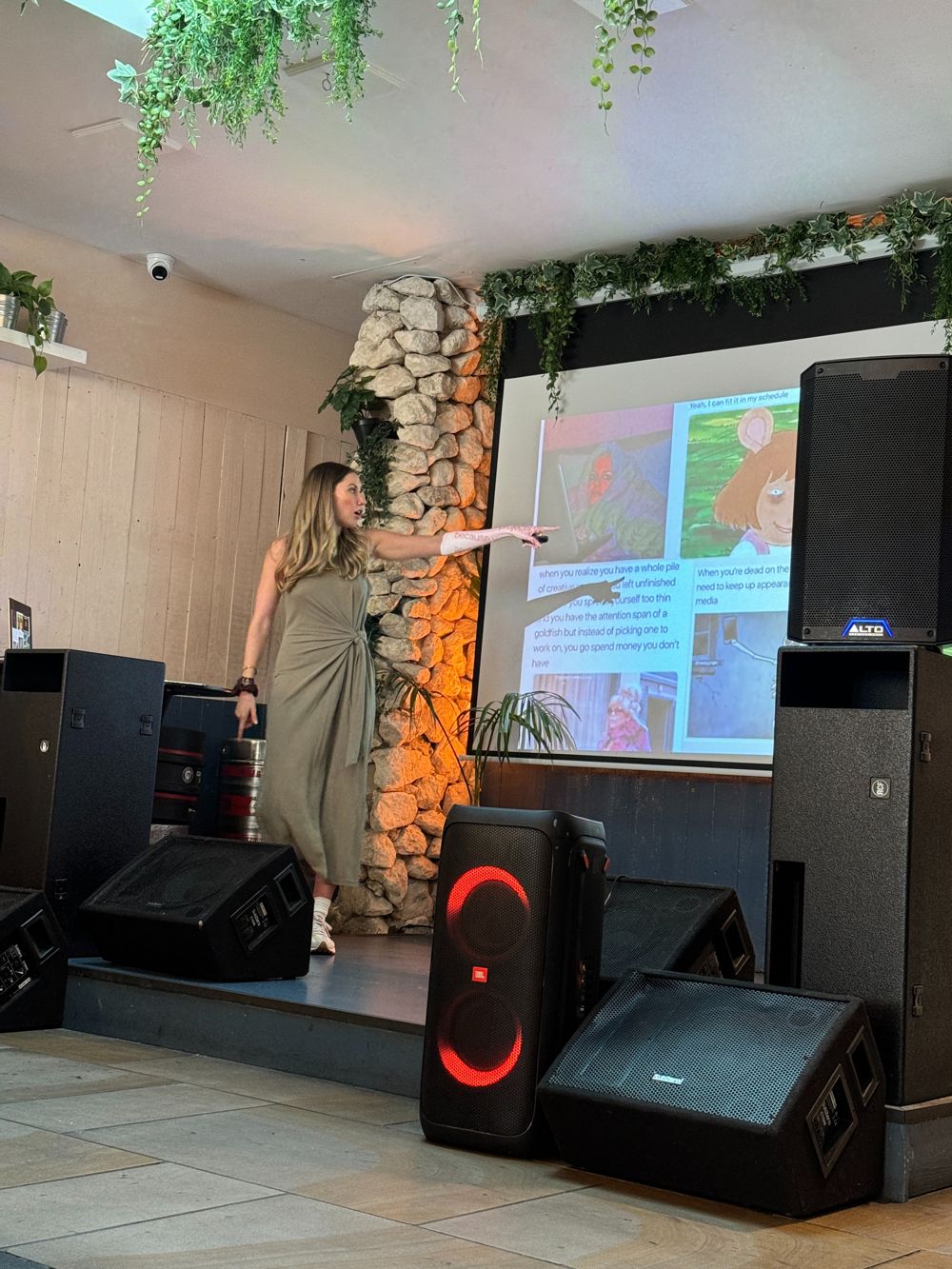 Lucy presenting on stage at a Klaviyo team event